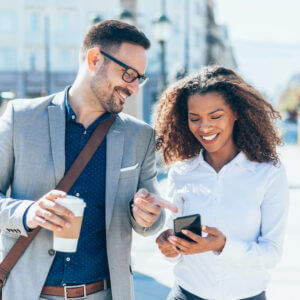 Two colleagues collaborating on a text using conversational customer engagement