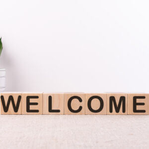 Welcome sign made of blocks to show an onboarding workflow