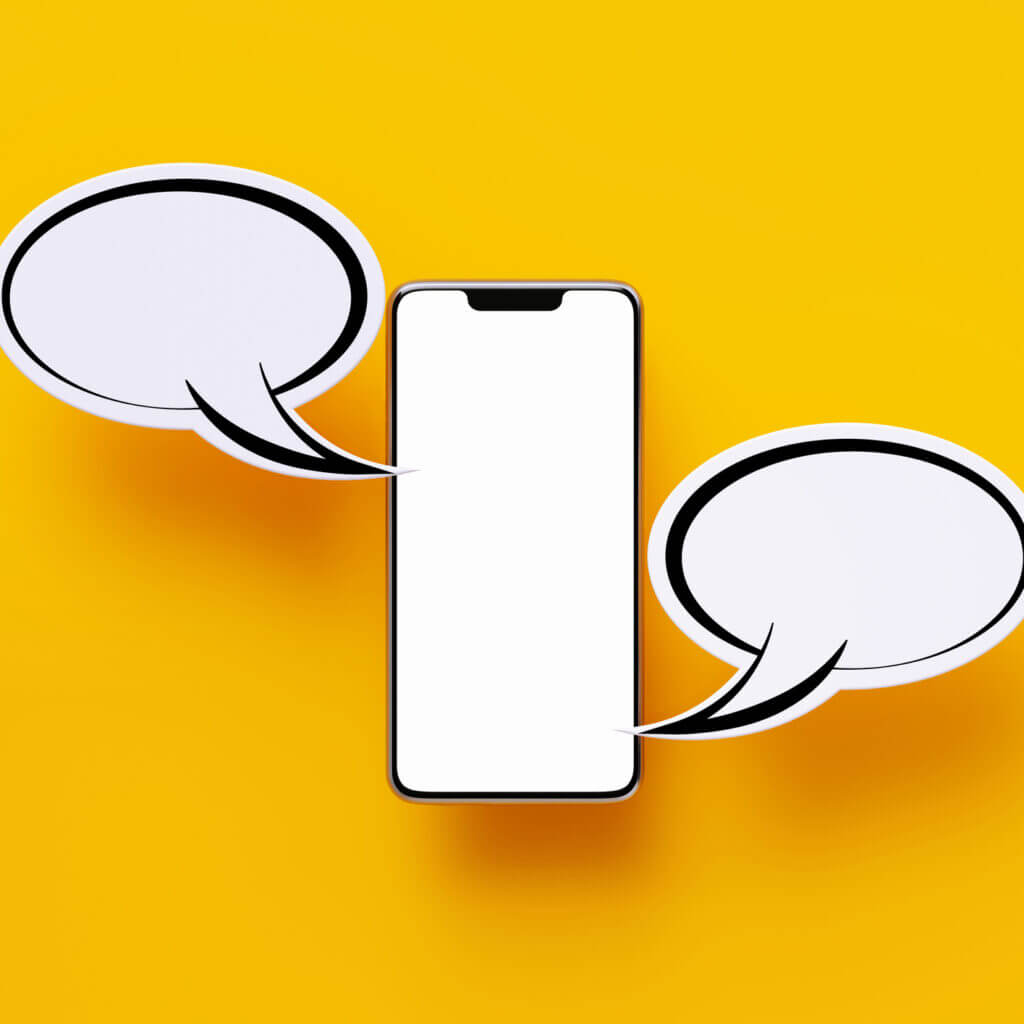 SMS templates, shown by cut-out paper in the shape of a phone and text bubbles