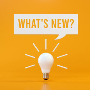 Lightbulb with what's new sign to show ecommerce customer engagement tools