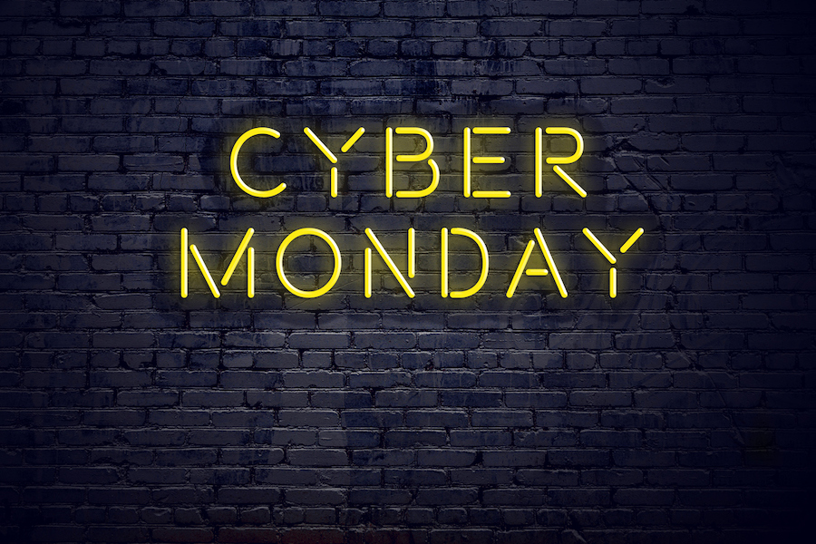 Text that reads cyber monday on a brick backdrop