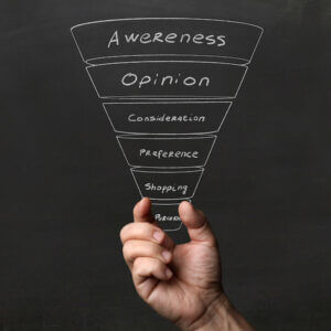 Hand holding up a marketing funnel, demonstrating how to build marketing funnels with business sms