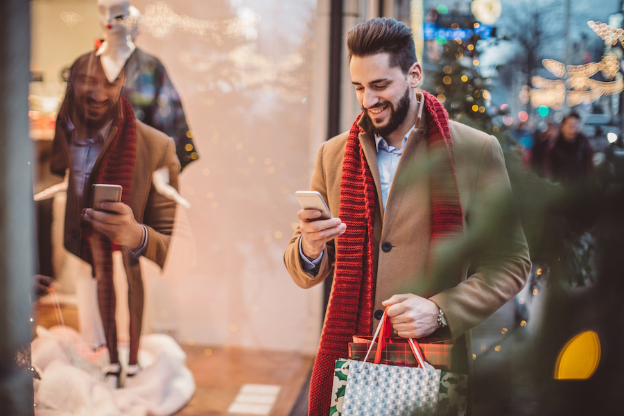 Man shopping and texting