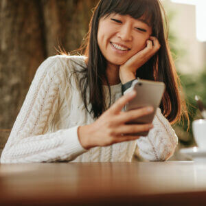 Woman receiving a thank you text