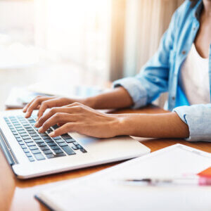 Woman typing on computer