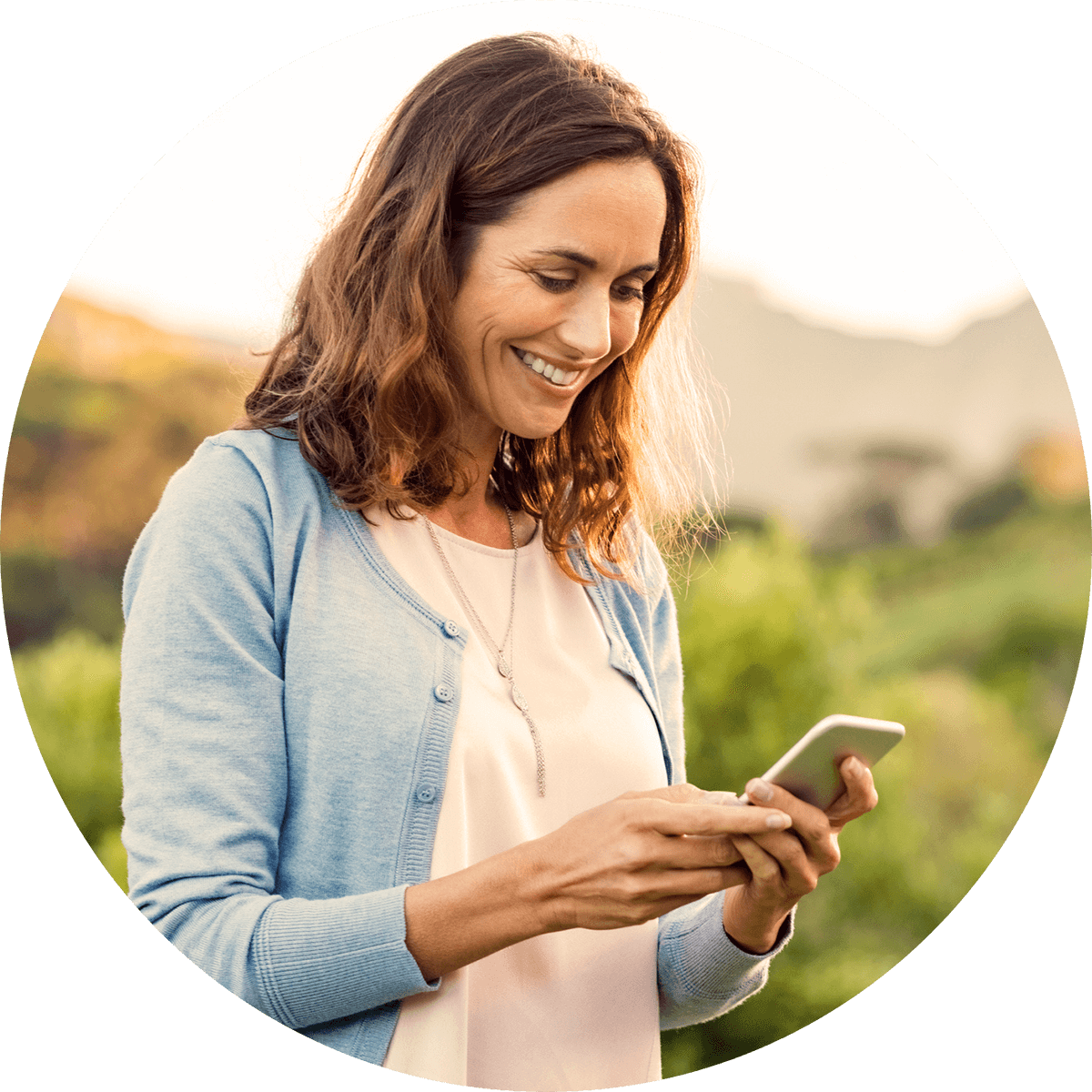 Woman in yard texting utilizing text messaging for home services