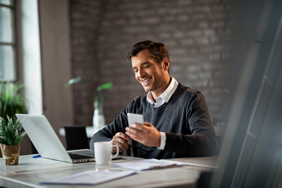 Finance professional smiling at incoming client message