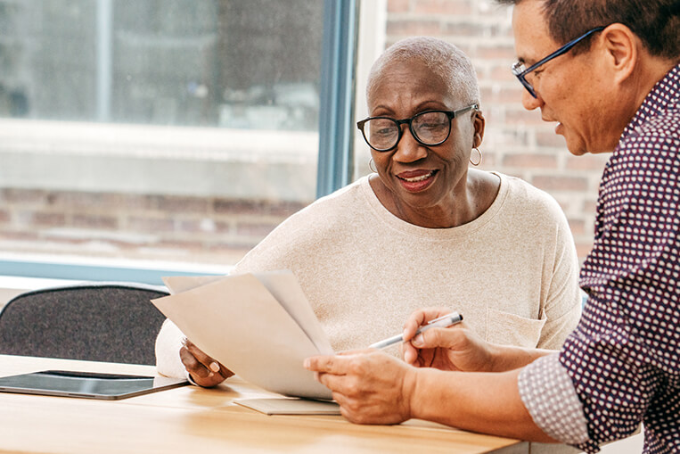 Insurance agent going over contract with client