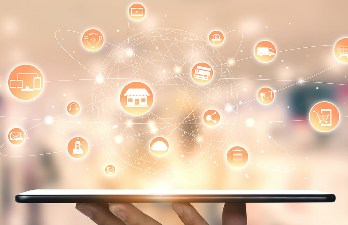 Tablet held face up with illustrated bubbles coming out of it; bubbles have images of a cloud, a house, an agent, and more
