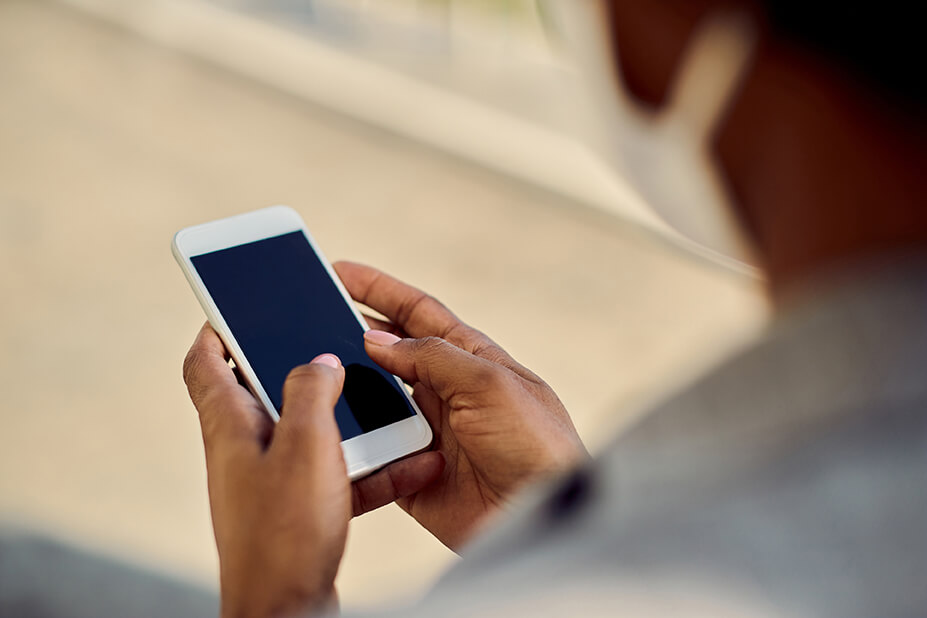 Close-Up of Woman Texting during COVID