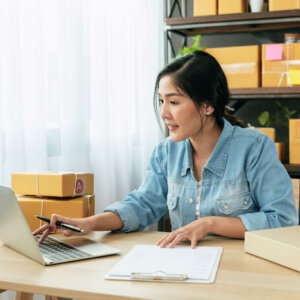 eCommerce store owner working on her computer