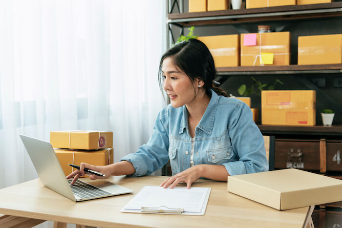 eCommerce store owner working on her computer