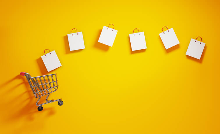 Shopping cart with shopping bags coming out of it