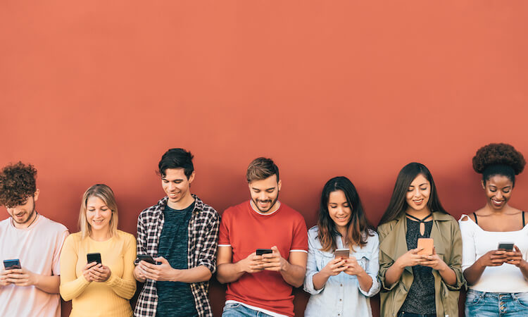 Group of young students on their phones