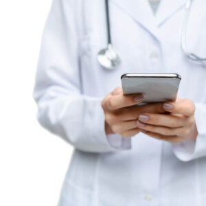 A healthcare provider using a tablet