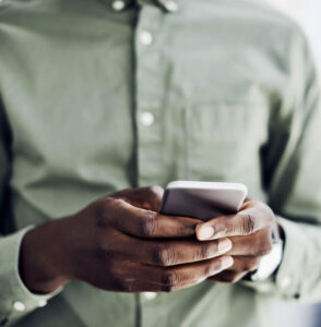 Man's hands with mobile phone