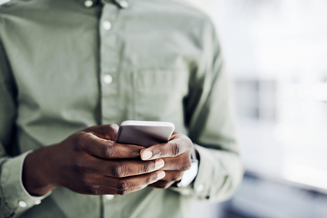 Man's hands with mobile phone