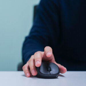 Hand on computer mouse