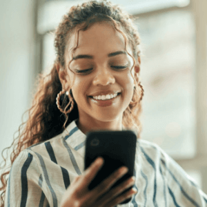 Woman smiling and texting
